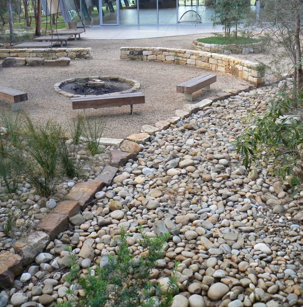 Our landscaping stonework maximises beauty and comfort in this naturalistic garden design with low sandstone walls