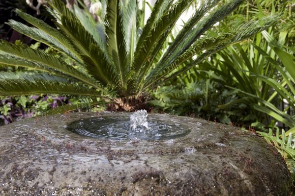 this lovely water feature imitates a bubbling brook