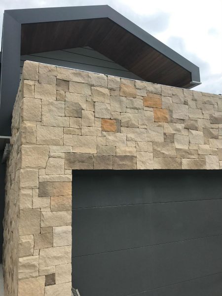 landscape design and construction featuring sandstone cladding on elements of house exterior
